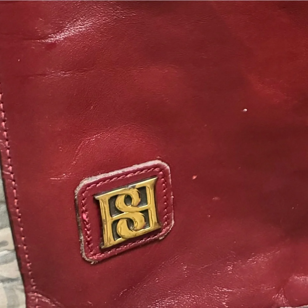 Real leather clutch, burgundy color, hard snap closure